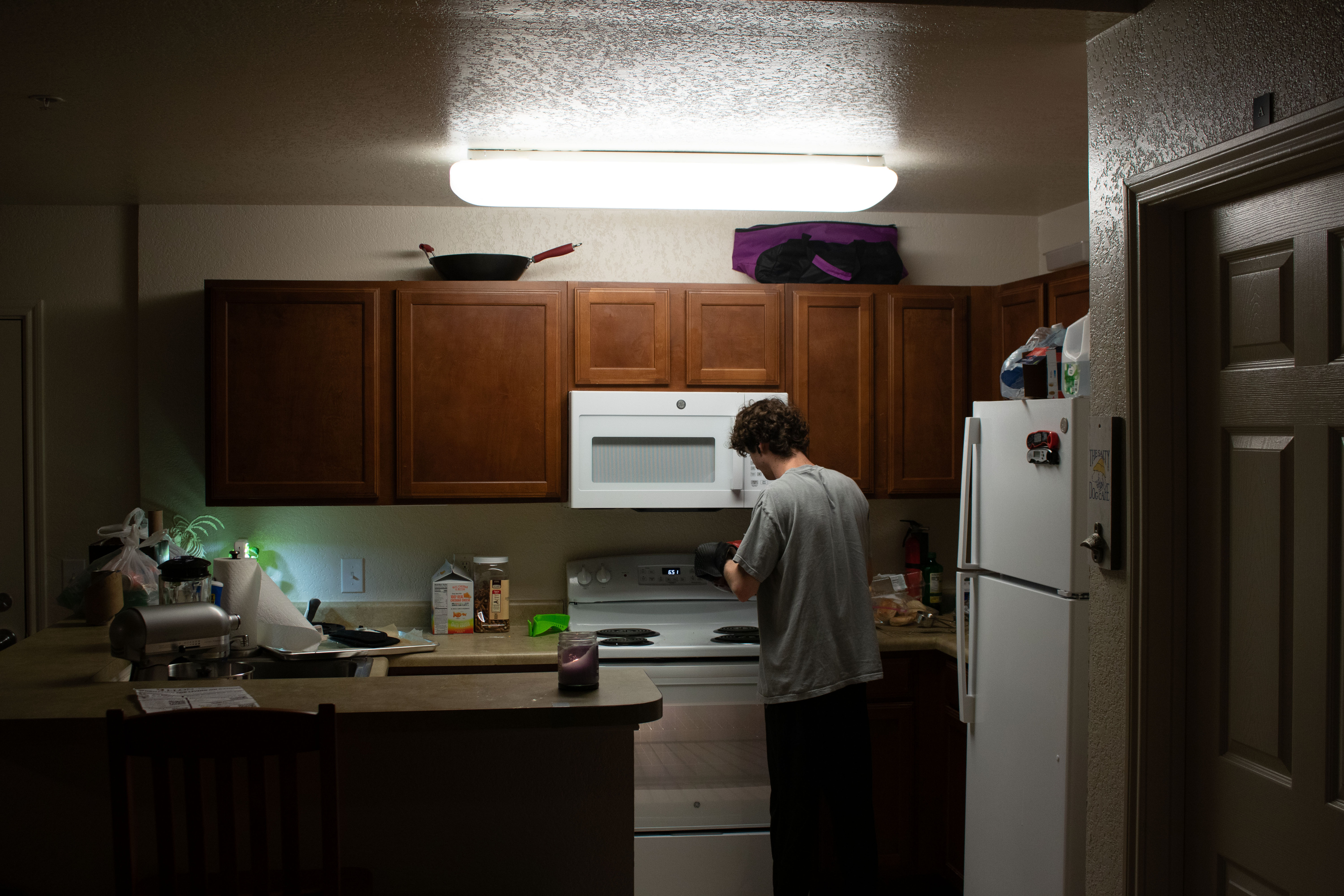 Person in kitchen at night